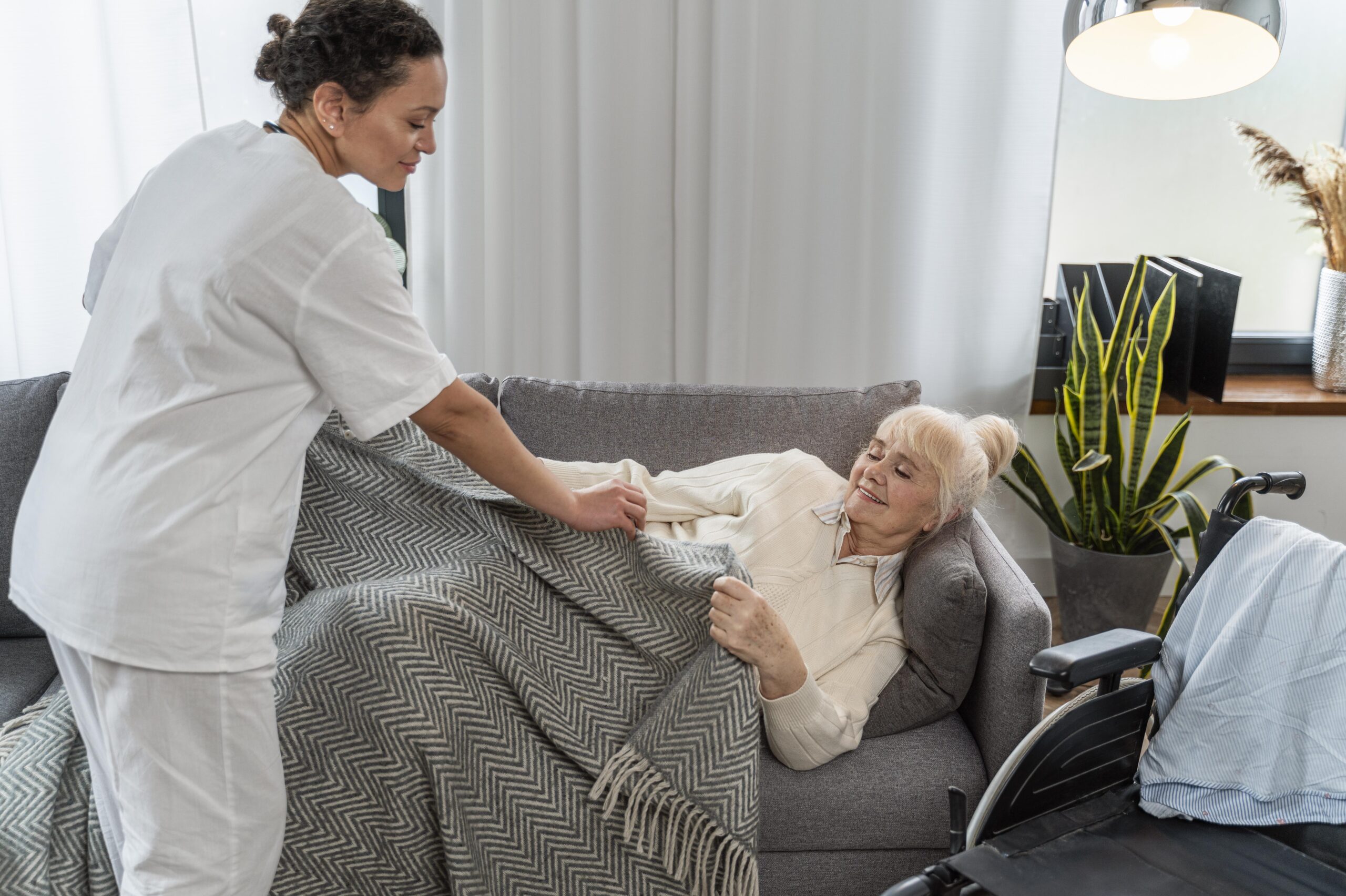 doctor-taking-care-senior-woman-home