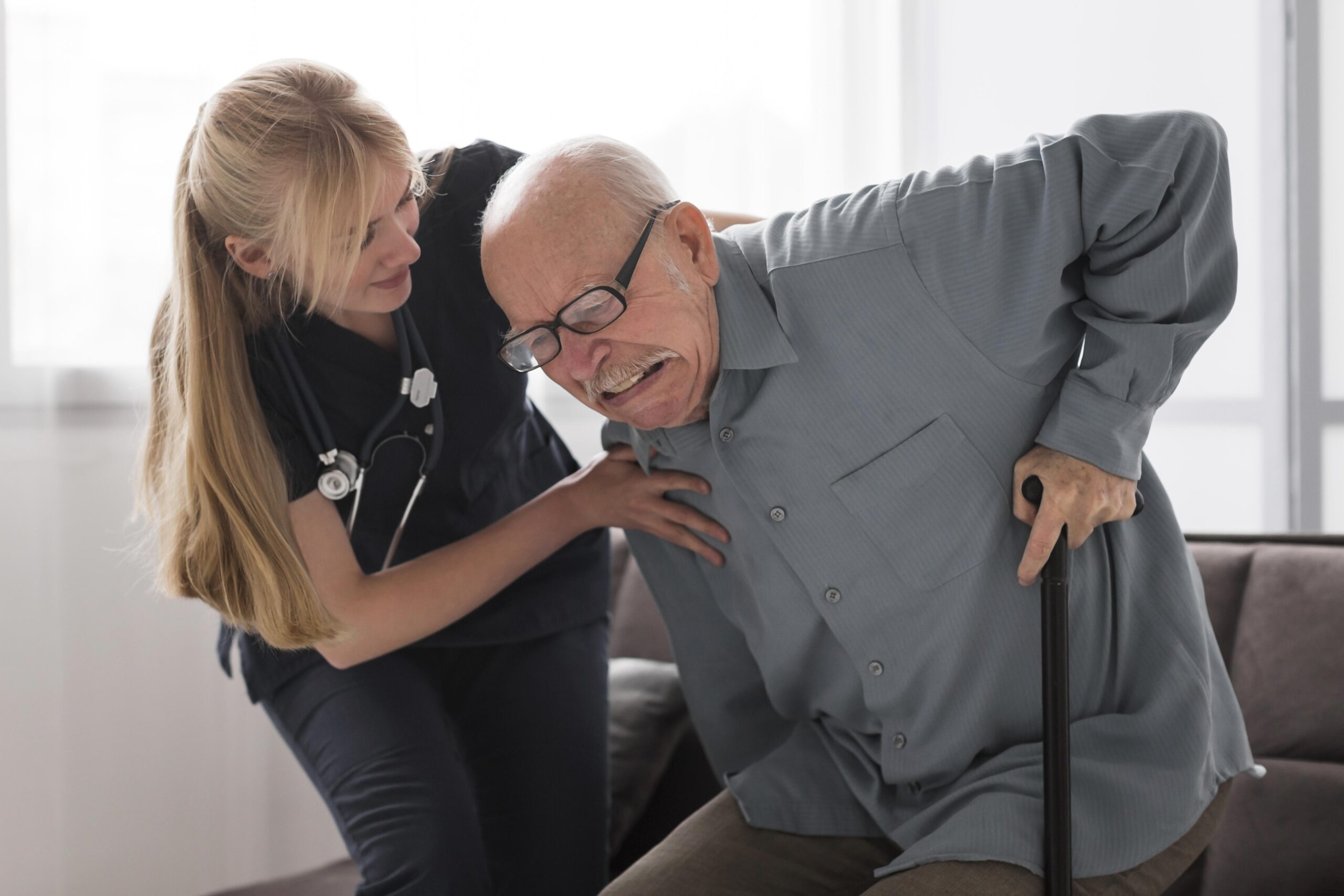 old-man-pain-helped-by-nurse